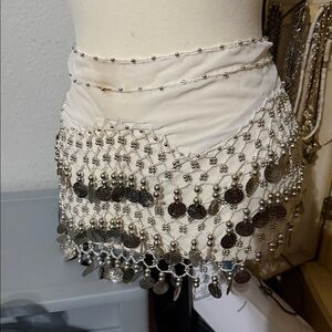 A BELLY DANCERS ATTIRE.  JINGLES . MOVE YOUR HIPS AND MAKE SOME NOISE.